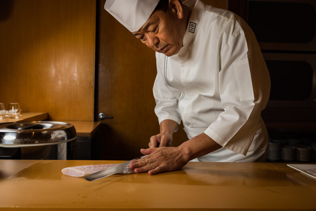 Chef Fujita preparing sushi at Nozawa Bar